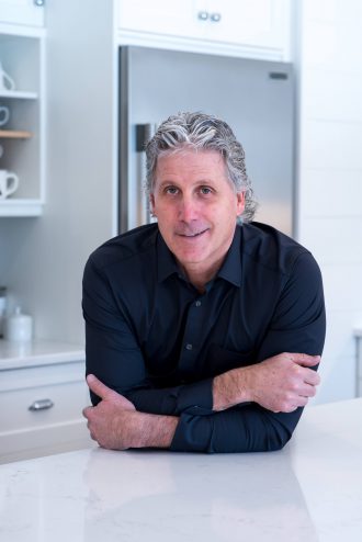 Paolo Zulian leaning on a counter