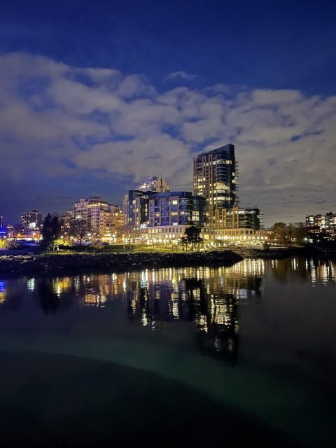 Shot of Central Burlington at night, reflecting on the water