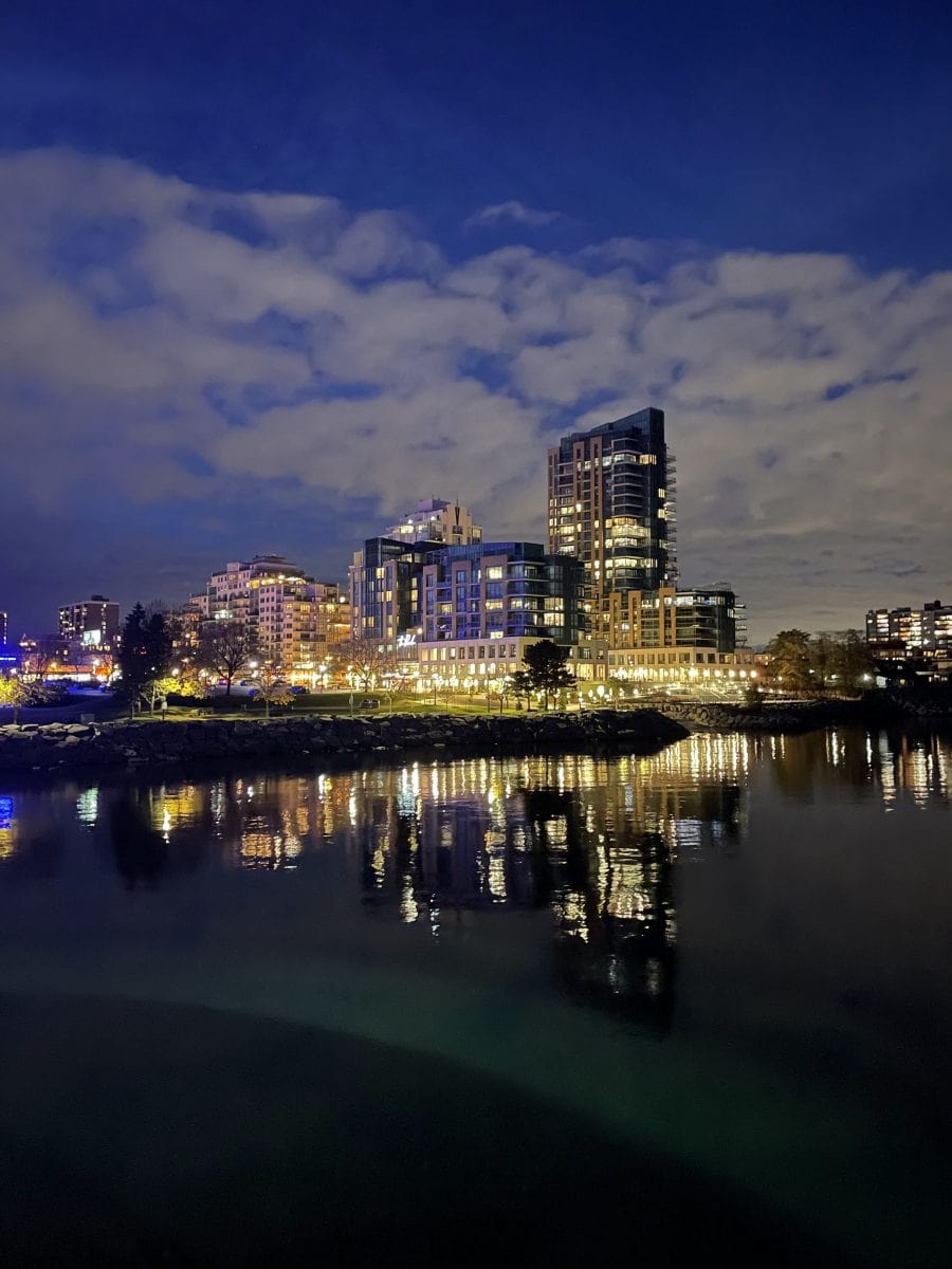 Shot of Central Burlington at night, reflecting on the water